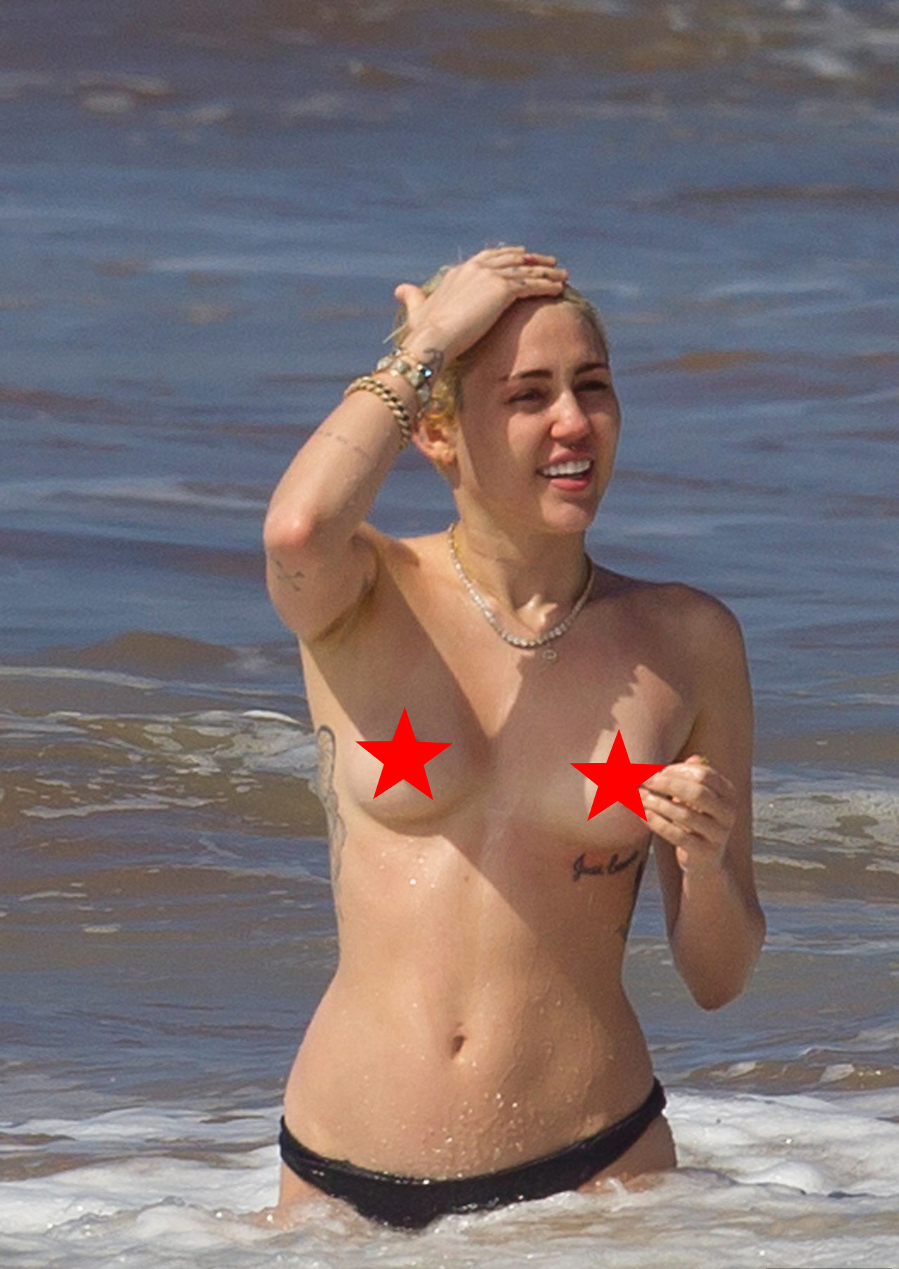 HOT! Miley Cyrus Topless At The Beach - Showing FULL TITS