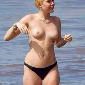 Miley Cyrus boobs naked walking through water