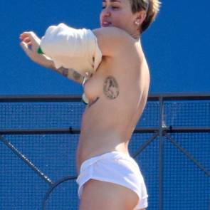 Miley Cyrus on terrace with naked boobs featured