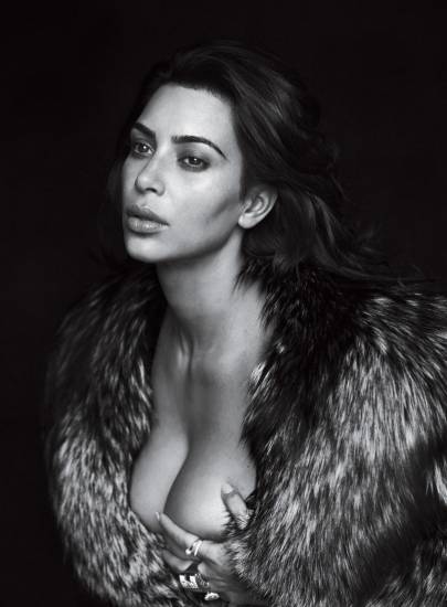 Kim kardashian naked in a fur coat only covering her boobs with hands