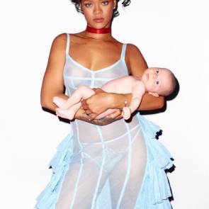 Rihanna In Topless And See Through Dress Holding A Baby