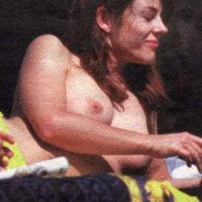 Elizabeth Hurley topless sunbathing