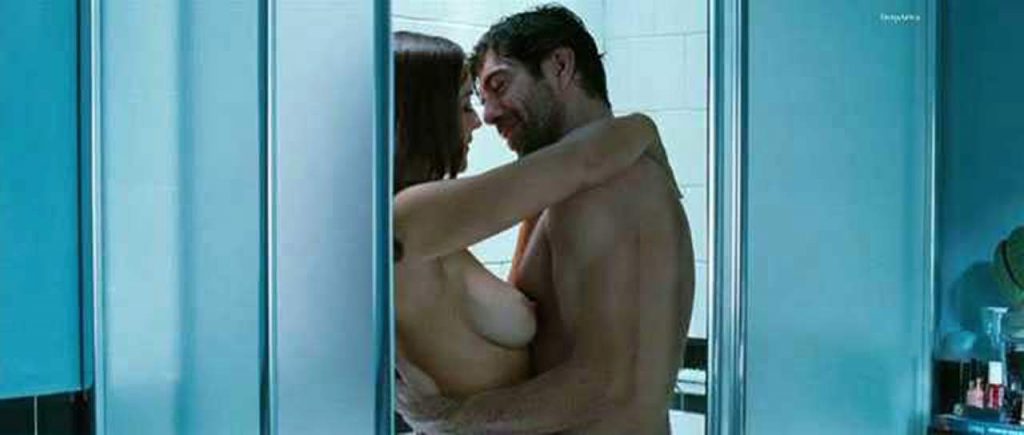 Monica Bellucci topless and kissing the guy