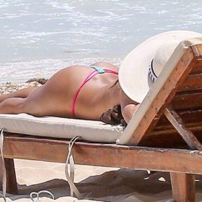 Arianny Celeste topless sunbathing