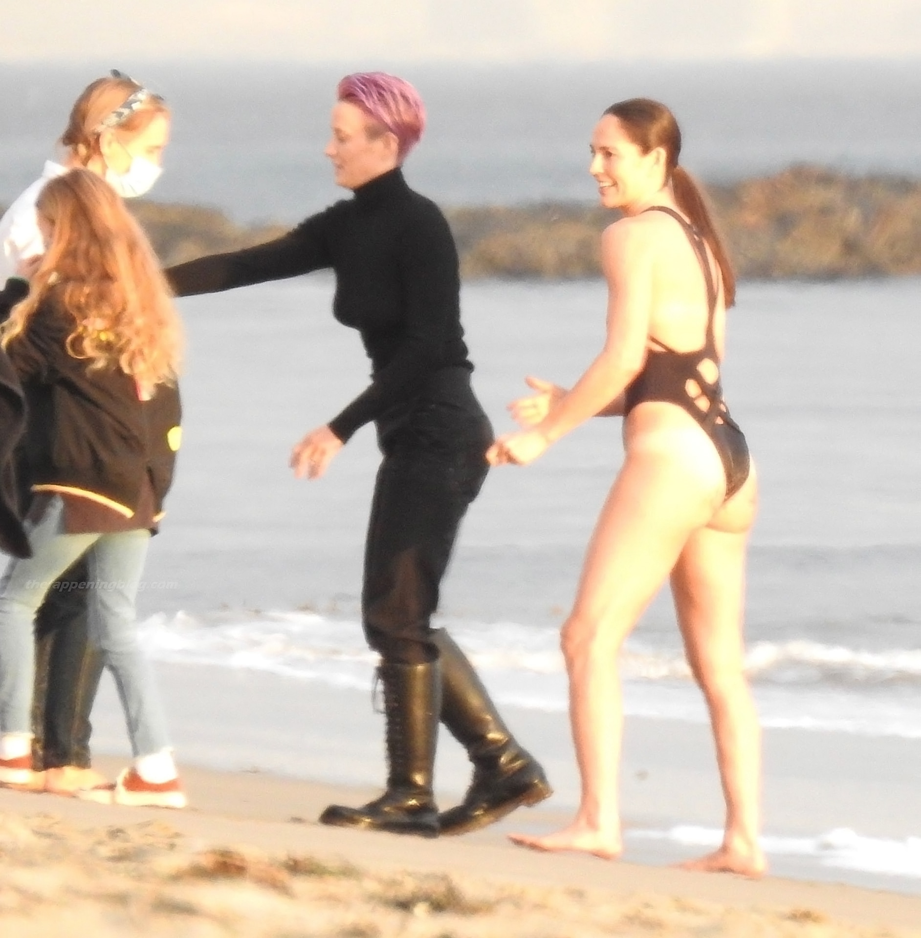 Megan Rapinoe and Sue Bird topless on the beach.