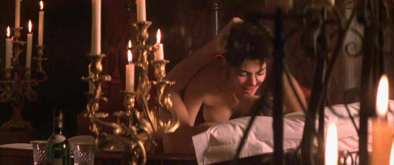 In the first scene, we can see Laura San Giacomo naked boobs while she is r...
