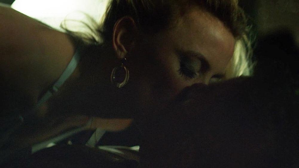 Then Riley Voelkel is making out with a guy in a parked car. 