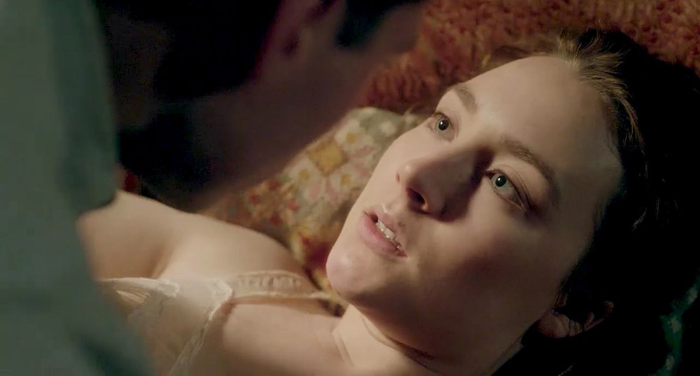 Blonde Saoirse Ronan is making out with a guy for a while. 