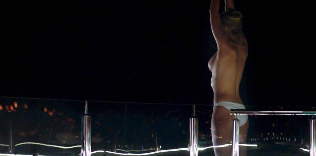 Nora Arnezeder nude sideboob and ass in dark scene