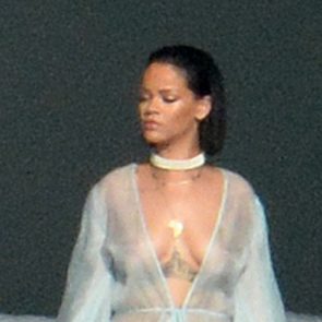 rihanna posing with gun with naked tits