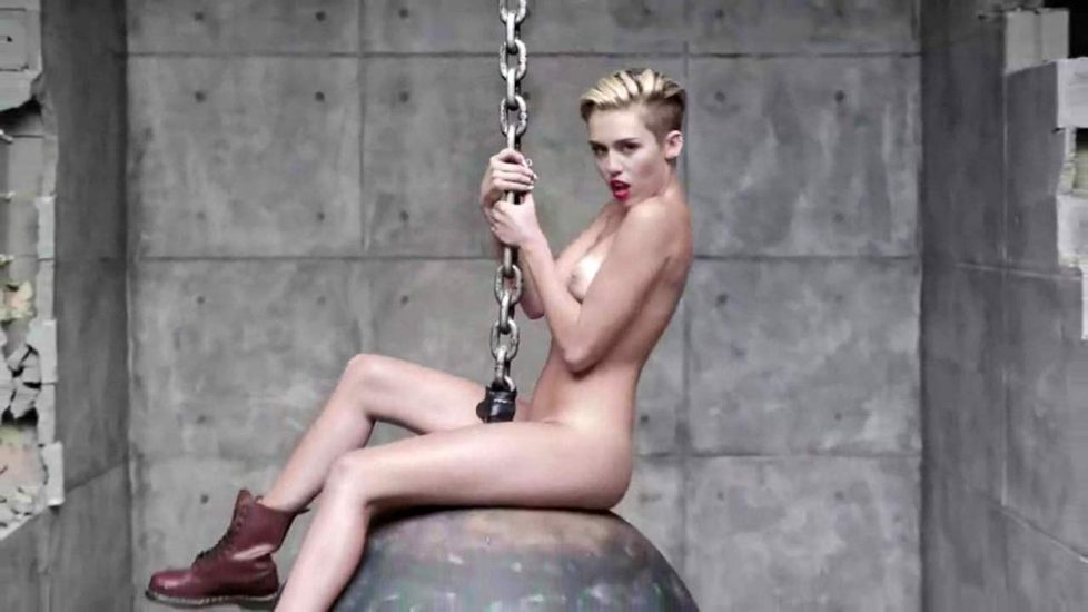 Miley Cyrus naked on the ball