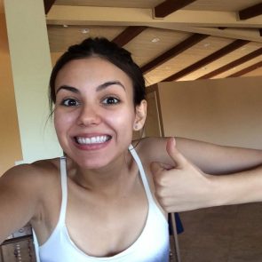 Victoria Justice in white tank top