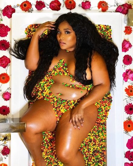 lizzo in bathtub full of candies