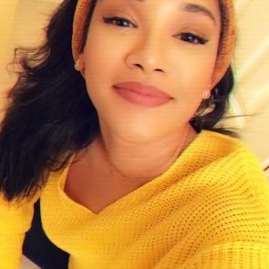 Candice Patton yellow sweater